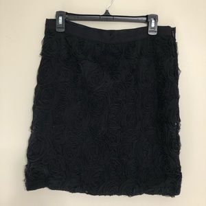 Black pencil skirt with florets.